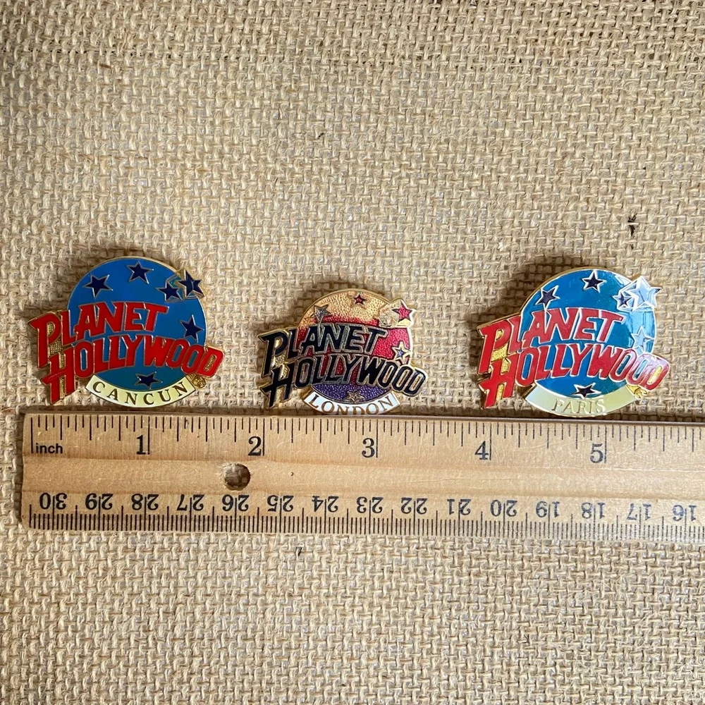 Planet Hollywood Cancun Paris London three pins in enamel over goldtone metal